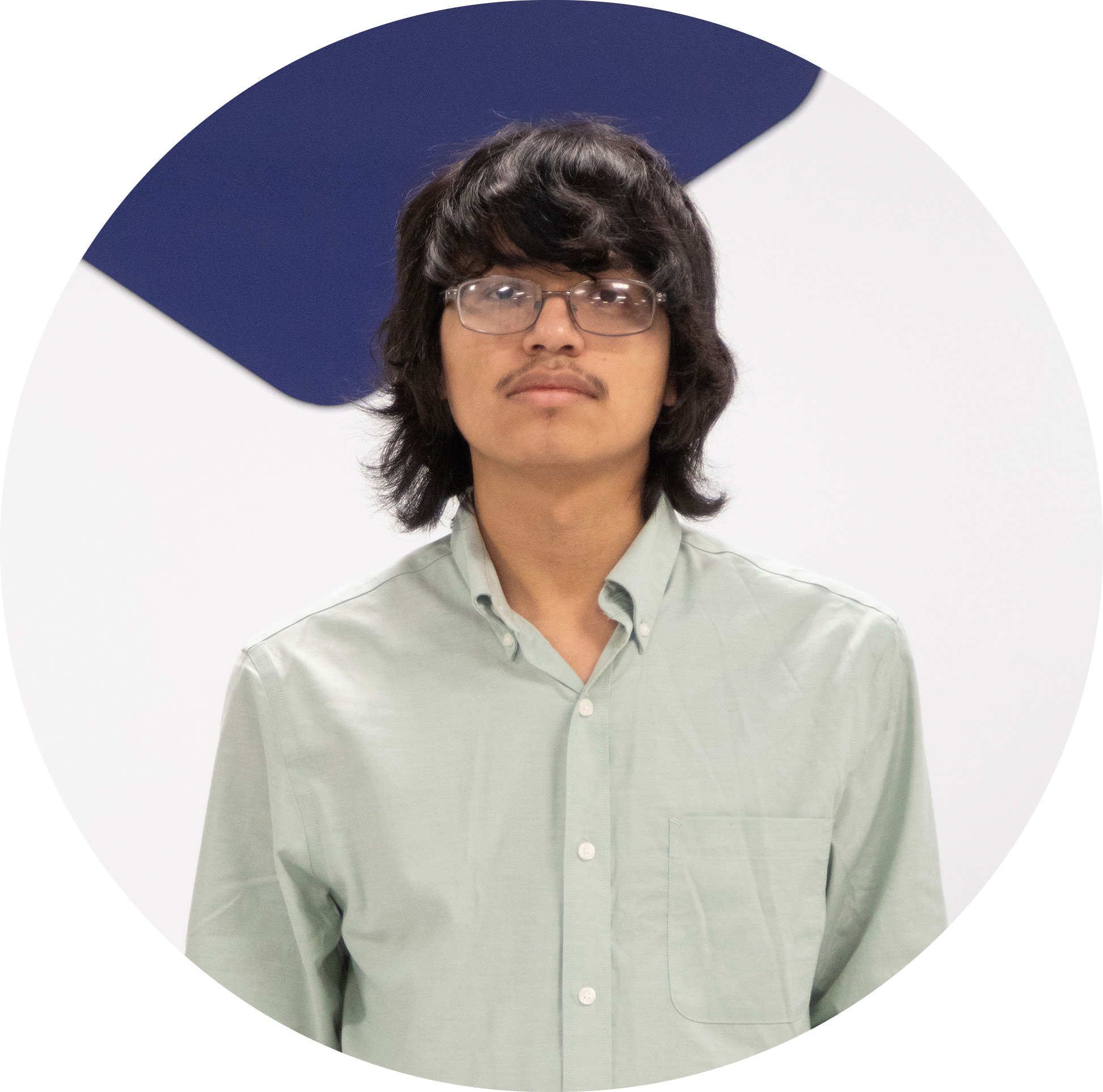 Image of Jesus sitting on a one seat sofa infront of the Base camp doors leading to the classes.